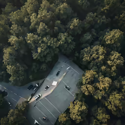 a parking lot with cars parked on top of it