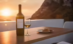 a plate of food and a glass of wine