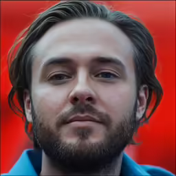 a close up shot of a guy with dark hair and beard