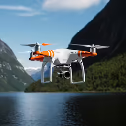 the white and orange djroxstar remote controlled flying in front of mountains and water