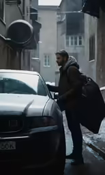 a man standing next to a car on the street