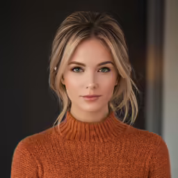 a woman in an orange sweater