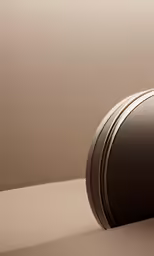 a black clock sits in the center of a room