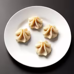 dim light dim white plate filled with dumplings