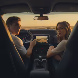 a couple is in the back of a truck