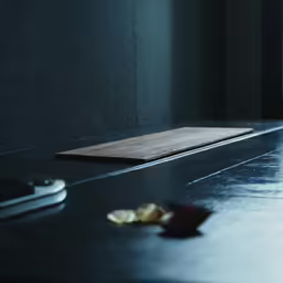 the table is covered in pieces of paper and nuts