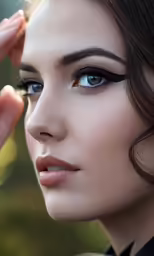 a woman wearing makeup with black and grey eyeshadp