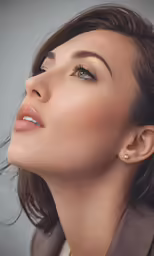 a close up photo of a woman in a brown jacket