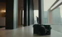 a person standing in an empty room next to a window