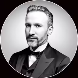a man in a tuxedo is looking at the camera