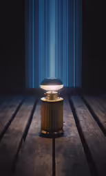 a wooden table with a lamp on top