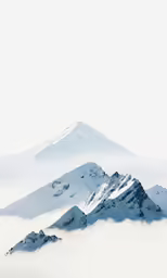 a snowy mountain range with low clouds surrounding it