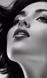 woman with elegant hairs and eyes makeup and hair blowing in the wind
