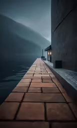 brick walk way going through fog over lake