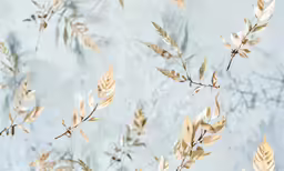 a bunch of leaves with the sky in the background