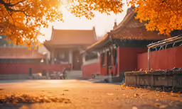 a chinese courtyard with some orange leaves