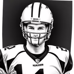 a black and white photo of a football player