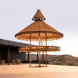 an umbrella stands with the words la meercaquin accal above it