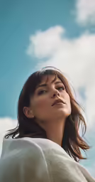 the young woman is looking away from the camera