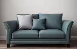 a light blue couch with several different pillows