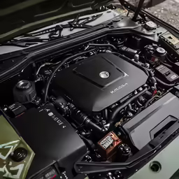 the engine of an automobile with its hood open