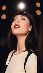 a woman standing and looking up in front of the sky