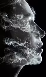 a man with long hair blowing out of the air