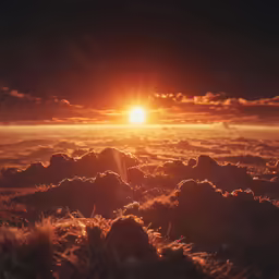 the sun is going down over rocky terrain