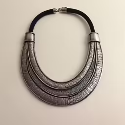 a necklace on a white table