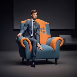 the man in a business suit sits on an orange and blue chair