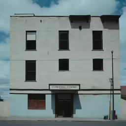 an old factory building in the desert on a clear day