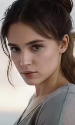 the model has a beautiful makeup and looks into the camera