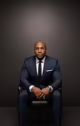 man in black suit and white dress shirt and black tie