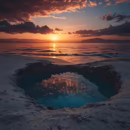 an icy lake is surrounded by dark clouds in the sunset