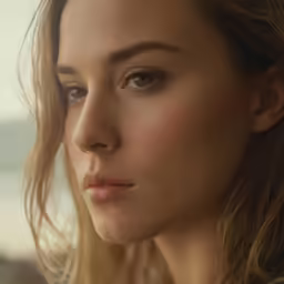 a girl looking into the distance with very strong hair