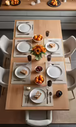 the table is set with many plates and bowls