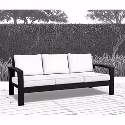a black and white photo of a couch with white cushions