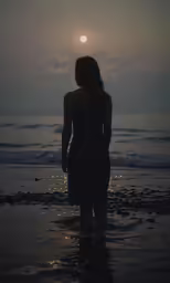 the silhouette of a woman in the water with the sun in the background