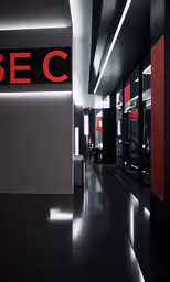 large black and white hallway with a sign reading bec