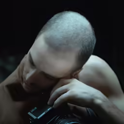 a man is photographed using a digital camera