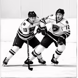 two hockey players are playing a game on the ice