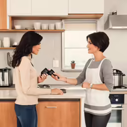 the woman is giving out something to the young lady