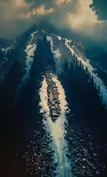 a snowy mountain with mountains and a lake