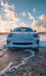 a white sports car driving on top of ice
