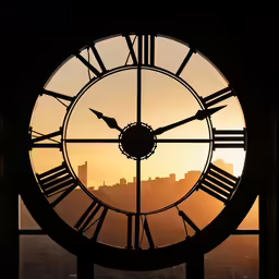 the view from a tall clock tower with a city skyline in the distance