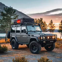 a land rover with a backlight sitting in the grass