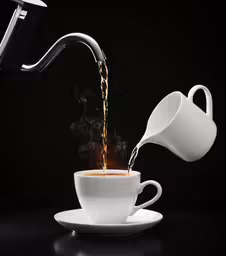 a coffee cup is filled with a beverage