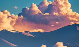 a colorful sky and some mountains under some clouds