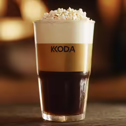 a very tasty looking beverage served with a scoop of hot chocolate