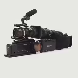 the canon c90 camera with a large lens and lens hood attached